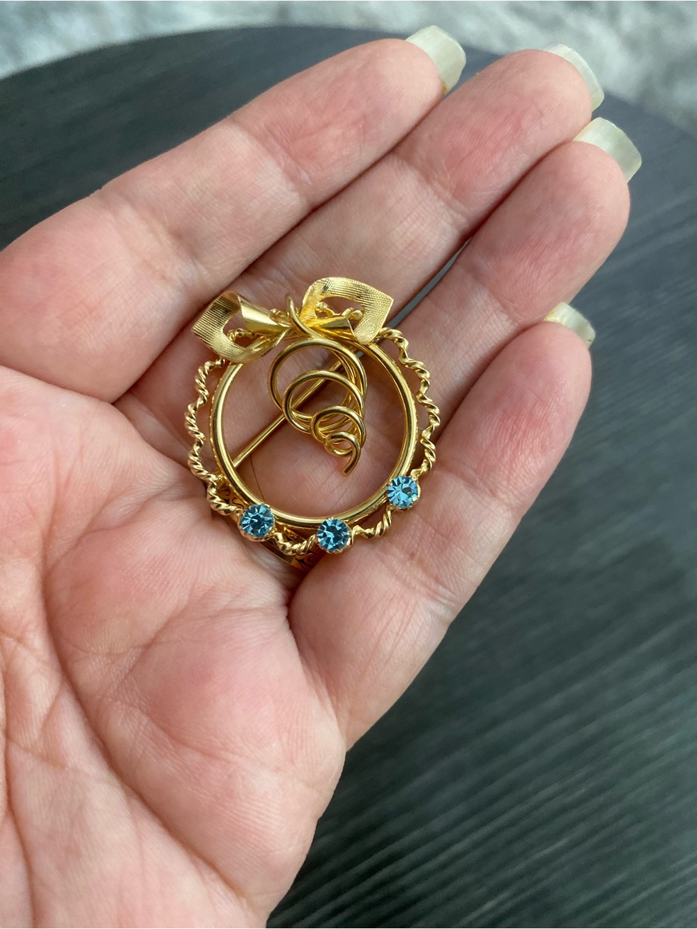 Gold-Tone Bow Wreath Brooch with Blue Stones rainbow gold filed